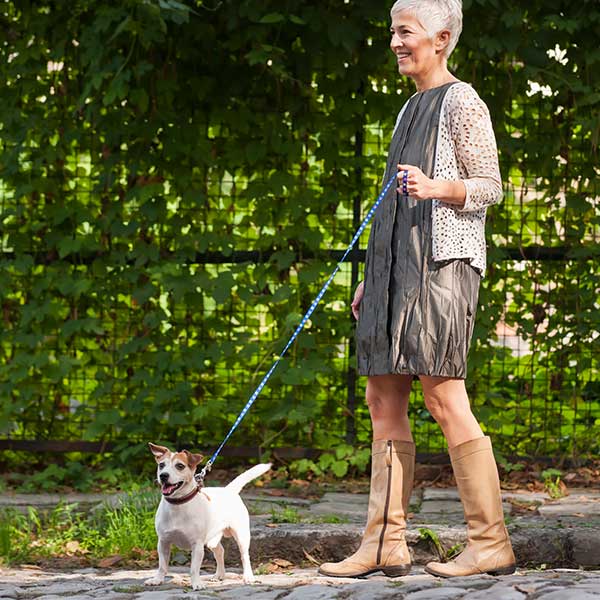 Exactech Ankle Replacement Women walking her dog outside